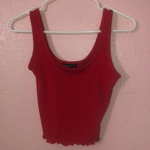 selling this cute red crop top wit ruffles on end